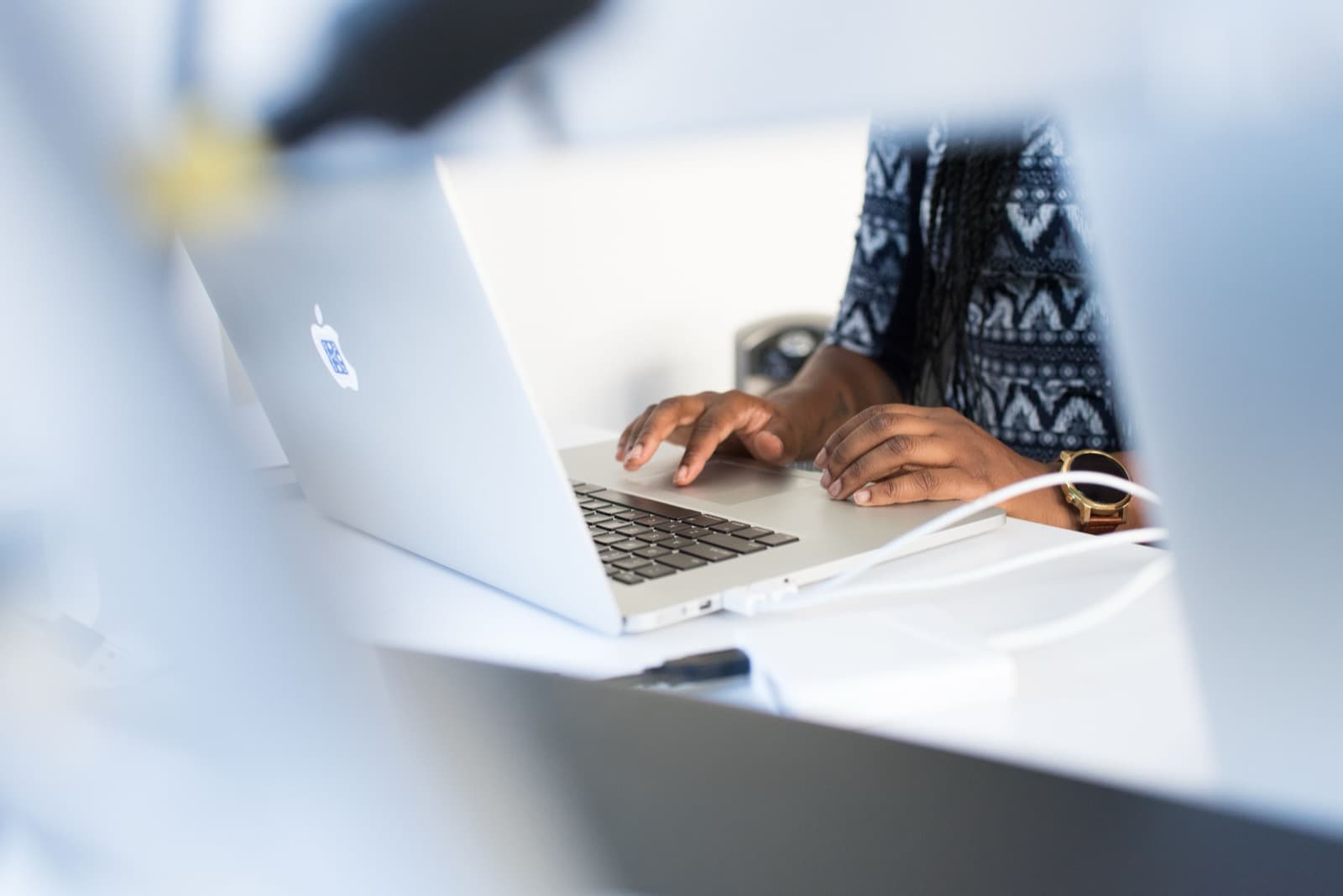 A data professional working at her laptop